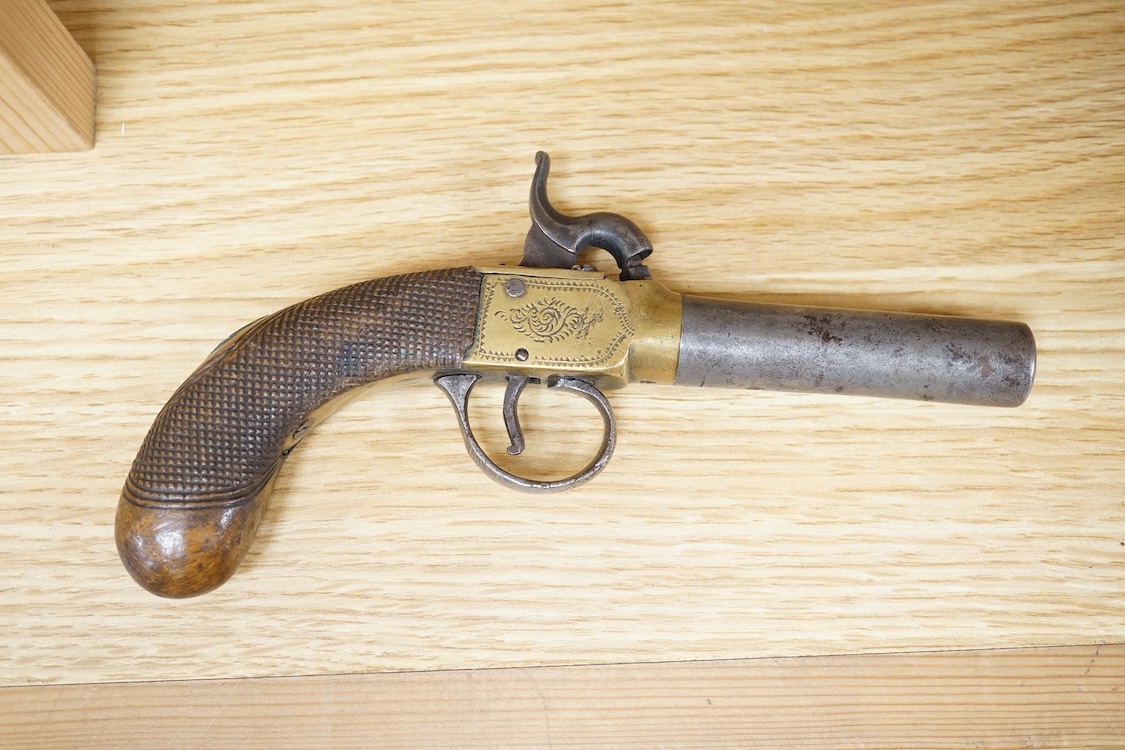A boxlock percussion pocket pistol with turn off barrel, Birmingham proofs, engraved brass frame, and chequered rounded walnut grip